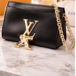 Luxurious Black Shoulder Bag with Gold Chain by Louis Vuitton